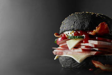 Image showing Black Burger with Cheese.