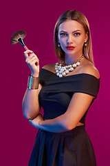 Image showing Woman makeup artist standing with brush