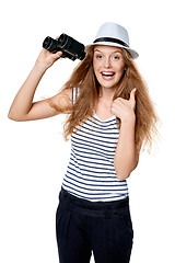 Image showing Female with binoculars gesturing thumb up