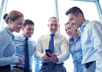 Image showing happy businesspeople with smartphone