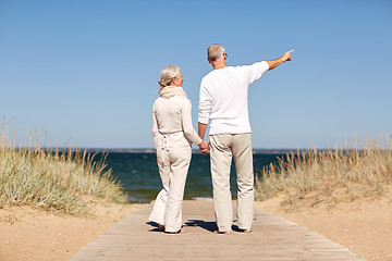 Image showing happy senior couple on summer beach