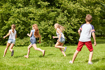 Image showing happy kids running and playing game outdoors