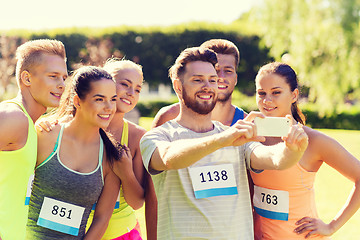 Image showing teenage sportsmen taking selfie with smartphone