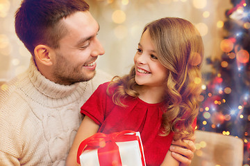 Image showing smiling father and daughter looking at each other