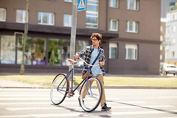 Image showing young man with fixed gear bicycle on crosswalk