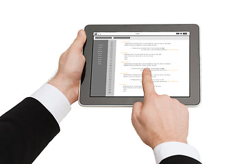 Image showing close up of hands holding tablet pc with coding