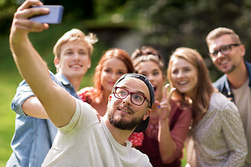 Image showing friends taking selfie by smartphone at summer