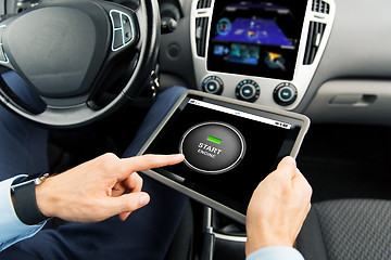 Image showing close up of man with tablet pc in car