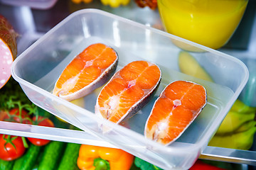 Image showing Raw Salmon steak in the open refrigerator