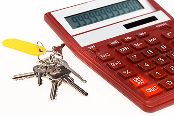 Image showing The red calculator with a keys on a white background