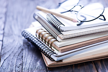 Image showing Stack of spiral notebooks