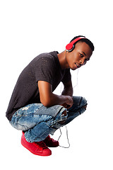 Image showing Handsome teenager listening to music