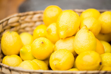Image showing close up of fresh ripe lemons in basket