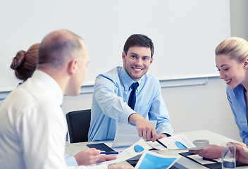 Image showing business people with papers meeting in office