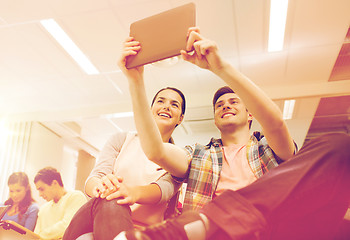 Image showing group of smiling students with tablet pc