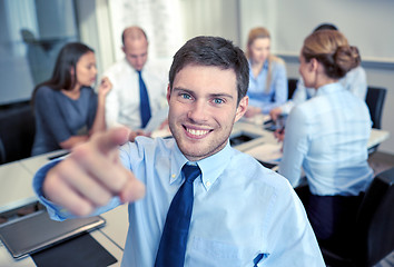 Image showing group of smiling businesspeople meeting in office