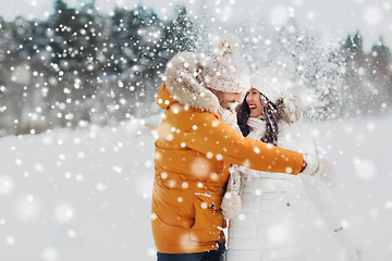 Image showing happy couple hugging and laughing in winter