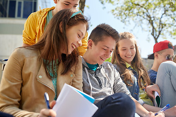 Image showing group of students with notebooks at school yard