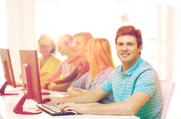 Image showing male student with classmates in computer class