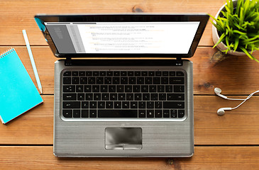 Image showing close up of laptop computer on wooden table