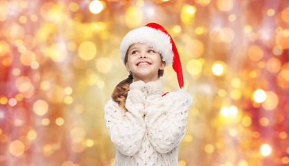 Image showing dreaming girl in santa helper hat