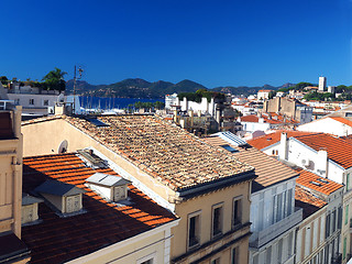 Image showing  rooftop view Cannes France old town fort in background   