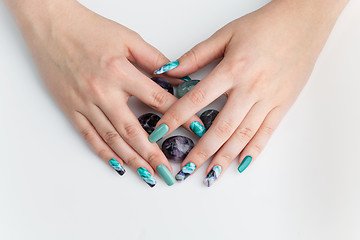 Image showing Closeup of woman hands with colorful nails