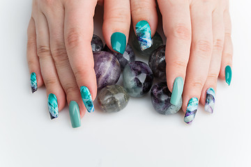 Image showing Closeup of woman hands with colorful nails