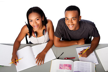 Image showing Two happy academic students studying together