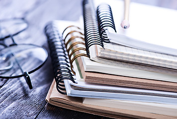 Image showing Stack of spiral notebooks