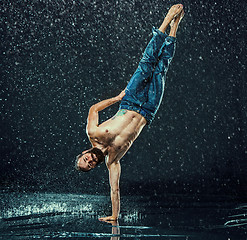 Image showing The male break dancer in water.