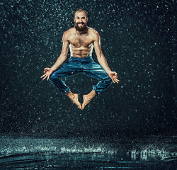 Image showing The male break dancer in water.