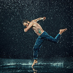 Image showing The male break dancer in water.