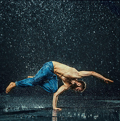 Image showing The male break dancer in water.