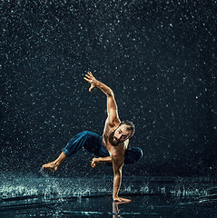 Image showing The male break dancer in water.