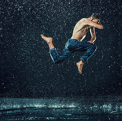 Image showing The male break dancer in water.