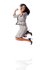 Image showing Winning business woman jumping cheering