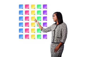 Image showing Happy business woman presenting sticky notes