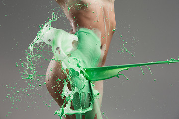 Image showing The beautiful woman with green liquid paint over her body