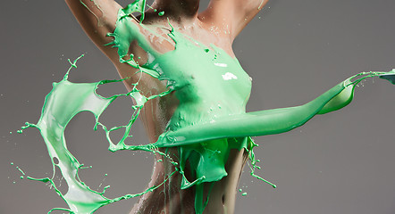 Image showing The beautiful woman with green liquid paint over her body