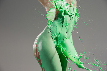 Image showing The beautiful woman with green liquid paint over her body