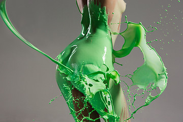 Image showing The beautiful woman with green liquid paint over her body