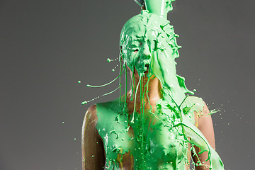 Image showing The beautiful woman with green liquid paint over her body