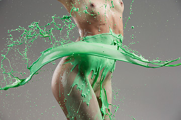 Image showing The beautiful woman with green liquid paint over her body