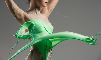 Image showing The beautiful woman with green liquid paint over her body