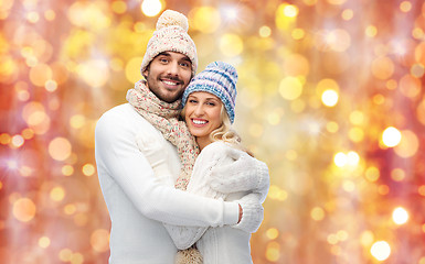 Image showing smiling couple in winter clothes hugging