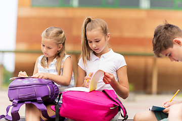 Image showing group of happy elementary school students outdoors