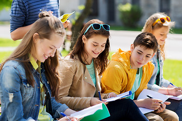 Image showing group of students with notebooks at school yard