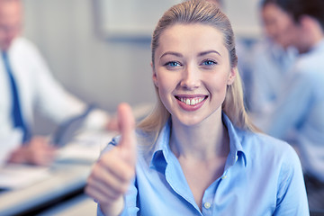 Image showing group of smiling businesspeople meeting in office