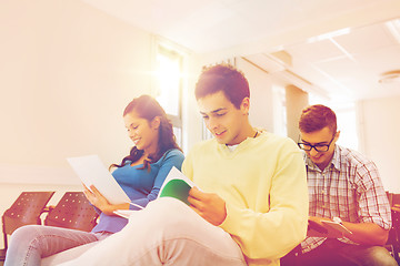 Image showing group of smiling students in lecture hall